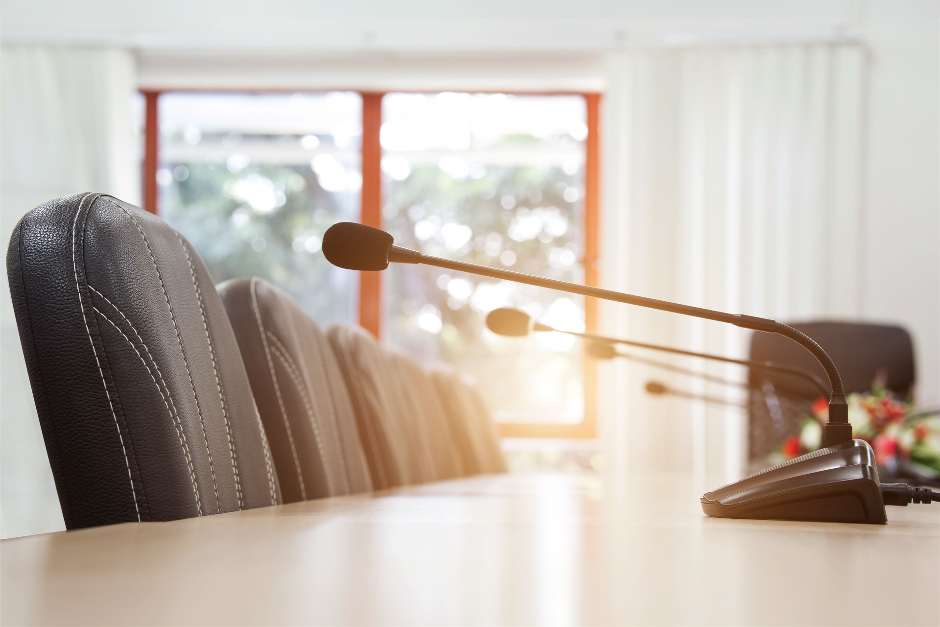 Conference microphone on conference table.